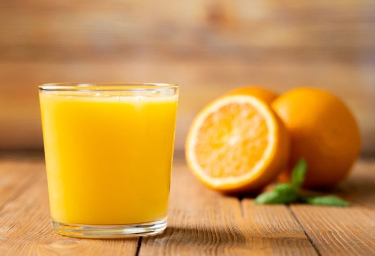 Shot of Fresh Orange Juice in a Glass